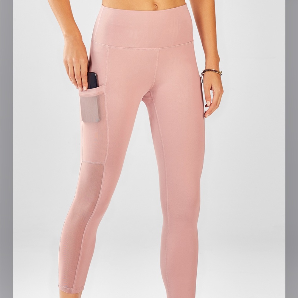 Cropped blush pink Fabletics compression leggings with pockets